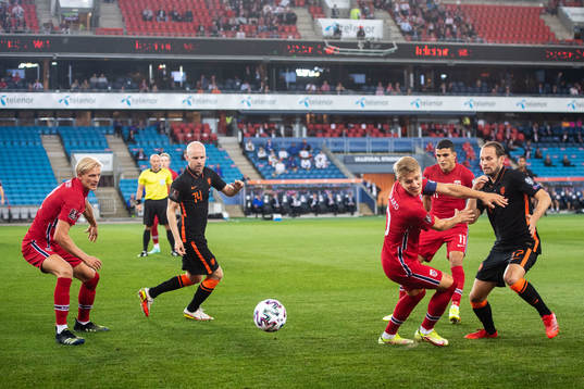 Martin Ødegaard of Norway and Daley Blind of Netherlands