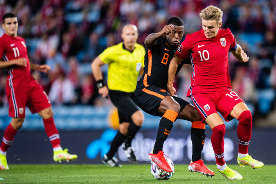 Georginio Wijnaldum of Netherlands and Martin Ødegaard of