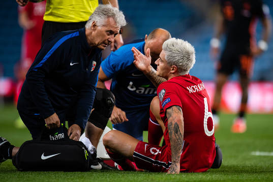 Mathias Normann of Norway get medical attention