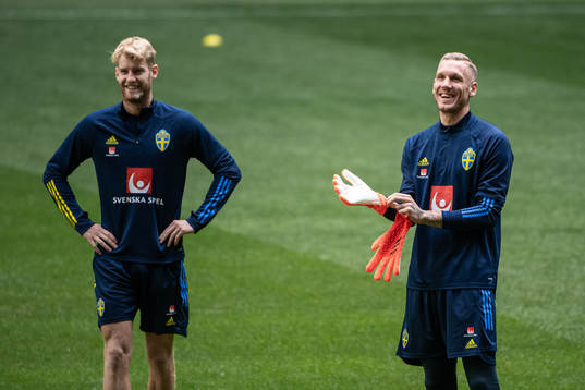Filip Helander and goalkeeper Robin Olsen of the Swedish
