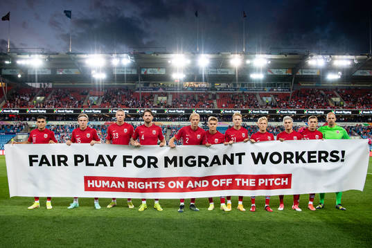 Norway's starting eleven pose for a team photo with a sign
