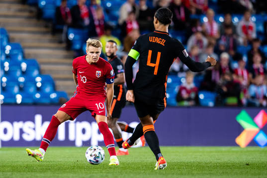 Martin Ødegaard of Norway and Virgil van Dijk of