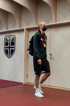 Goalkeeper André Hansen of Norway arrives wearing a face