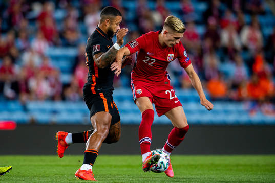 Memphis Depay of Netherlands and Marcus Holmgren Pedersen