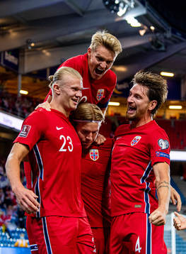Erling Braut Haaland of Norway celebrates with teammates