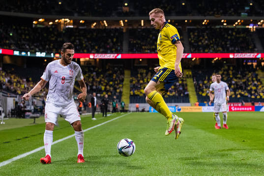 Koke of Spain and Dejan Kulusevski of Sweden