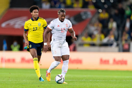Jens Cajuste of Sweden and Adama Traore of Spain