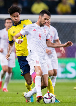 Jens Cajuste of Sweden and Sergio Busquets of Spain