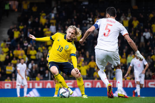 Emil Forsberg of Sweden and Sergio Busquets of Spain