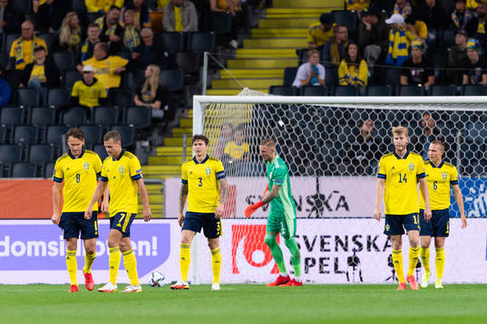 The Swedish players  look dejected