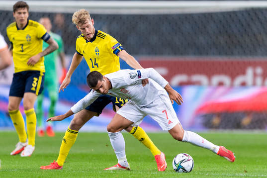 Filip Helander of Sweden and Alvaro Morata of Spain