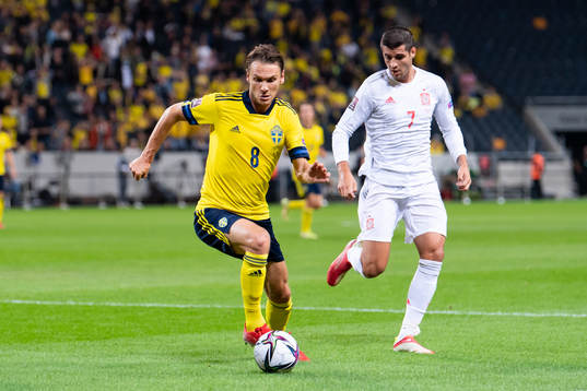 Albin Ekdal of Sweden and Alvaro Morata of Spain