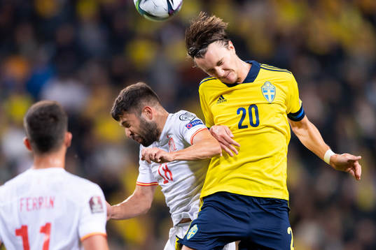 Jordi Alba of Spain and Kristoffer Olsson of Sweden