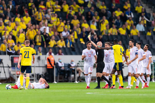 Dejan Kulusevski of Sweden is shown a yellow card