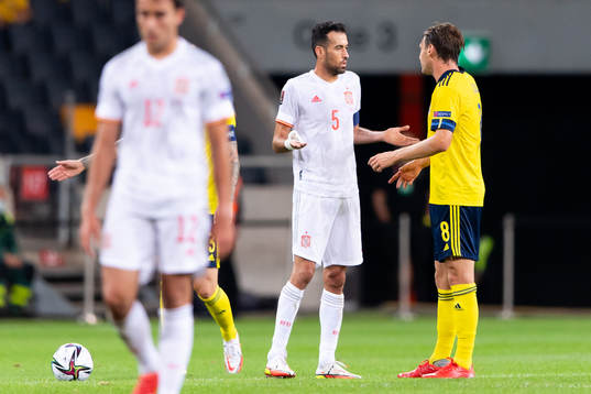 Sergio Busquets of Spain and Albin Ekdal of Sweden