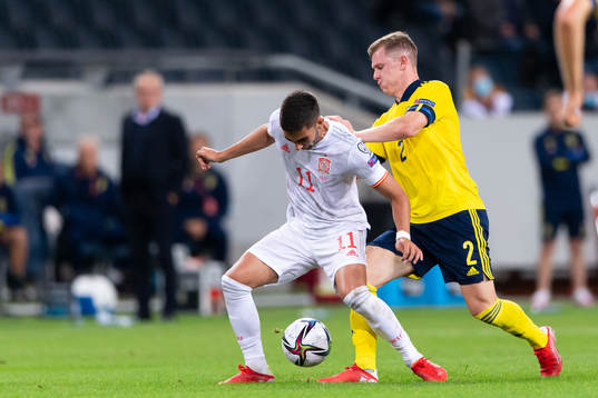 Ferran Torres of Spain and Emil Krafth of Sweden