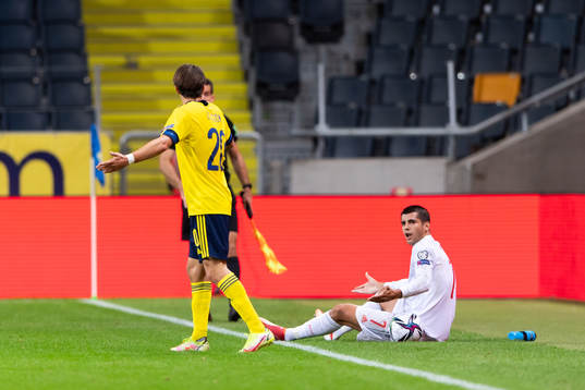Kristoffer Olsson of Sweden and Alvaro Morata of Spain