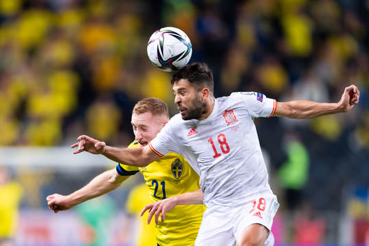 Dejan Kulusevski of Sweden and Jordi Alba of Spain
