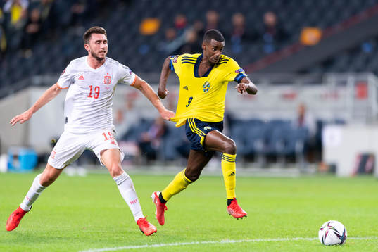 Aymeric Laporte of Spain and Alexander Isak of Sweden