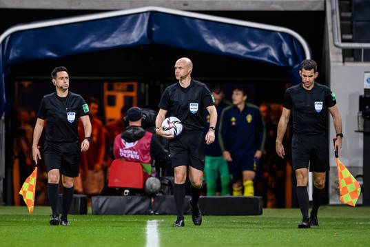referee Anthony Taylor with assistant referee Gary Beswick