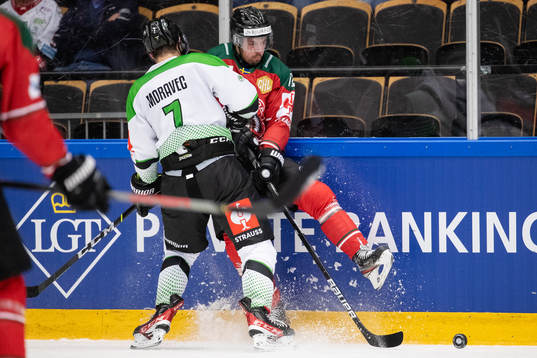 David Moravec of Mlada Boleslav hits Patrik Carlsson of