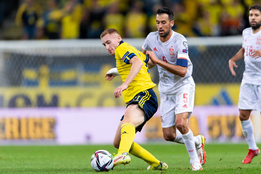 Dejan Kulusevski of Sweden and Sergio Busquets of Spain