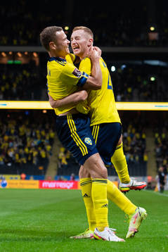 Viktor Claesson and Dejan Kulusevski of Sweden celebrate