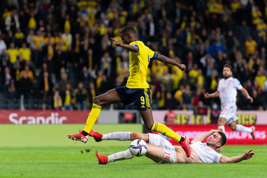 Aymeric Laporte of Spain and Alexander Isak of Sweden