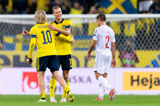 Emil Forsberg and Viktor Claesson of Sweden celebrate