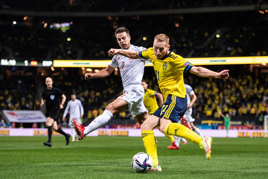Cesar Azpilicueta of Spain and Dejan Kulusevski of Sweden