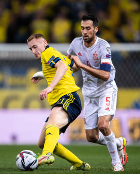 Dejan Kulusevski of Sweden and Sergio Busquets of Spain