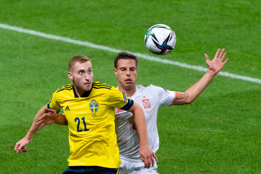 Dejan Kulusevski of Sweden and Cesar Azpilicueta of Spain