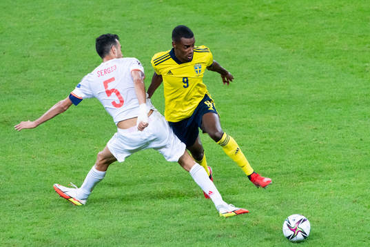 Sergio Busquets of Spain and Alexander Isak of Sweden