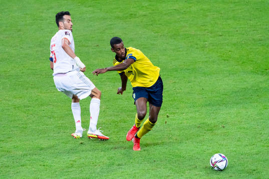Sergio Busquets of Spain and Alexander Isak of Sweden
