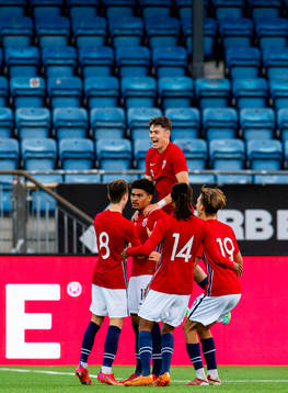 Noah Holm of Norway celebrates with teammates Håkon Evjen,