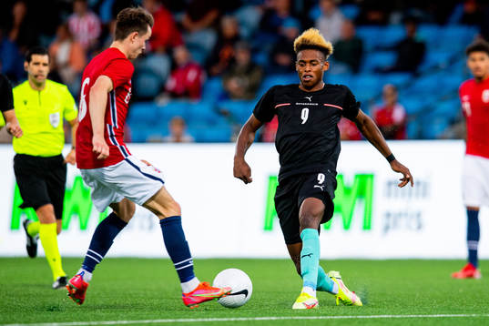 Håkon Evjen of Norway and Junior Adamu of Austria