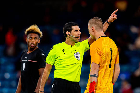 Matthew de Gabriele, referee, talks to goalkeeper