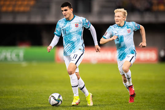 Mohamed Elyounoussi and Birger Meling of Norway