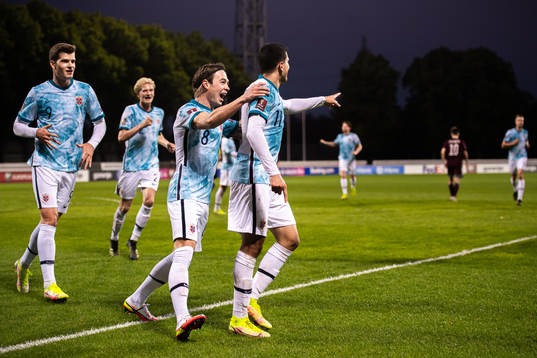 Alexander Sørloth and Patrick Berg celebrate with Mohamed