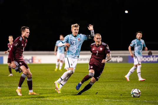 Martin Ødegaard of Norway and Vladimirs Kamess of Latvia