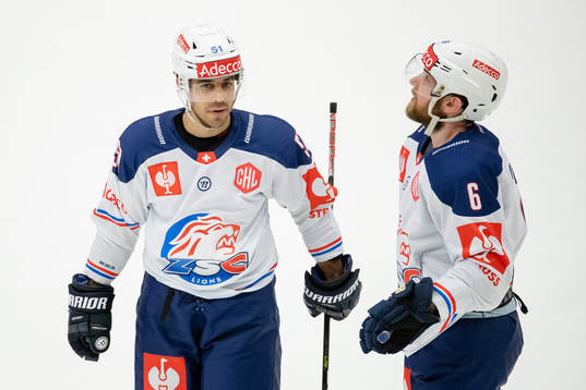 Justin Azevedo and Yannick Weber of Zurich look dejected