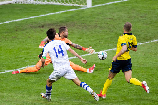 Eldor Shomurodov of Uzbekistan scores 2-1 behind goalkeeper