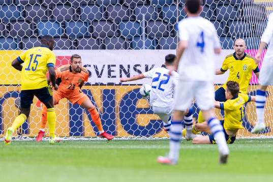 Goalkeeper Kristoffer Nordfeldt of Sweden, Oybek Bozorov of