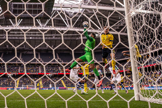 Goalkeeper Eldorbek Suyunov of Uzbekistan with a save
