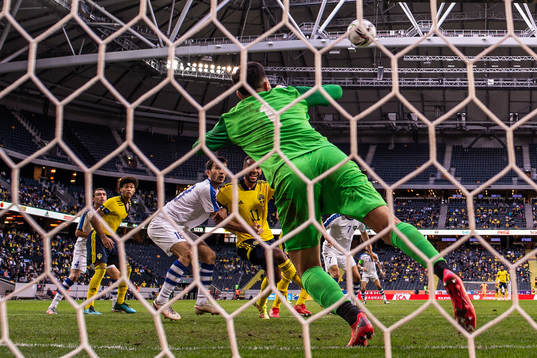 Goalkeeper Eldorbek Suyunov of Uzbekistan with a save in