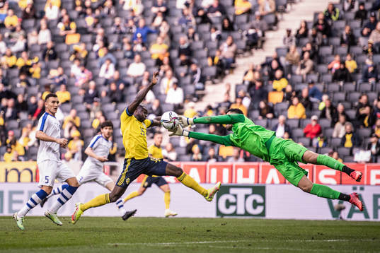 Ken Sema of Sweden and goalkeeper Eldorbek Suyunov of