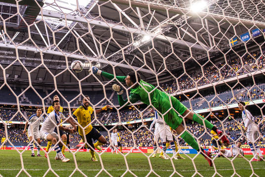 Goalkeeper Eldorbek Suyunov of Uzbekistan with a save in