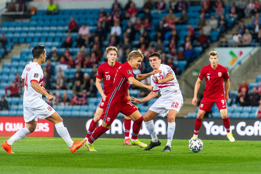 Martin Ødegaard of Norway and Graeme Torrilla of Gibraltar