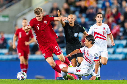 Alexander Sørloth of Norway and Aymen Mouelhi of Gibraltar