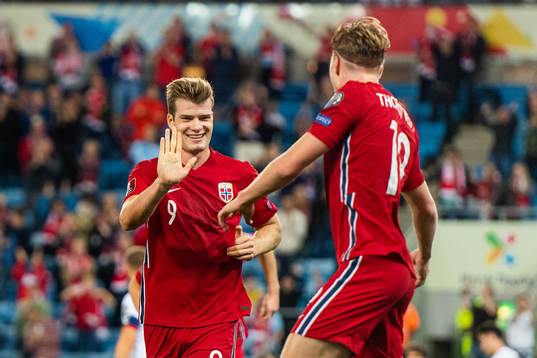 Alexander Sørloth celebrates with Kristian Thorstvedt of